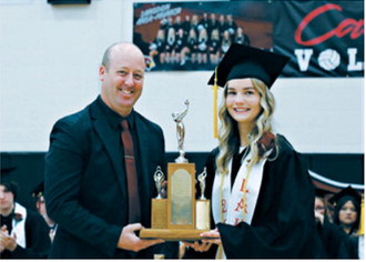 Mya Johnson accepts recognition as Outstanding Senior Girl for the Langdon Area High School Class of 2026 during commencement exercises May 24. Photo by Kacy Kakela