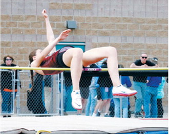 Taya Feist clears 4 feet, 10 inches in the high jump during the NDHSAA Class B State Track and Field Meet. Photo by Larry Stokke