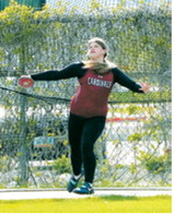 Fenja Lawson uncorks a throw of 134 feet, 1 inch to place third in the discus at the NDHSAA Class B State Track and Field Meet. Photo by Larry Stokke