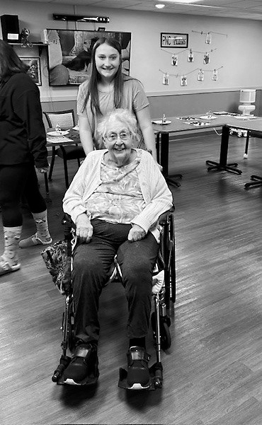 Gerry and Nolah smile for a photo during the sixth graders’ visit to PNC.