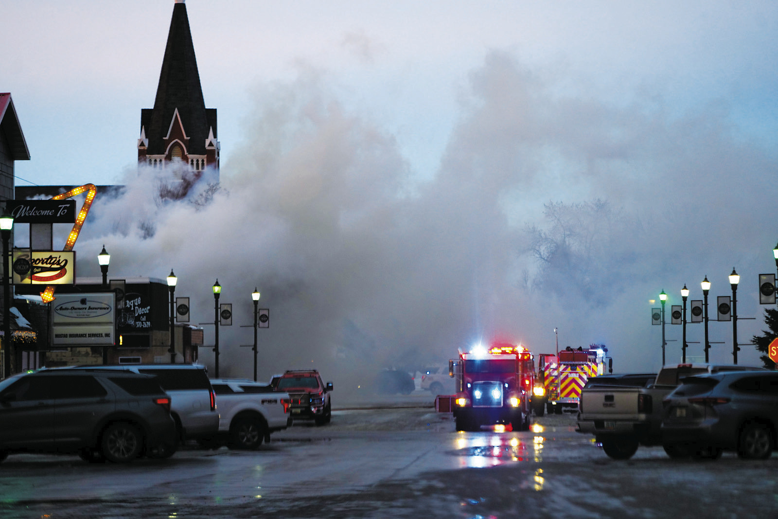 Large portions of the streets were blocked off due to being filled with plumes of black smoke from Sunday's fire. Photo by Larry Stokke.