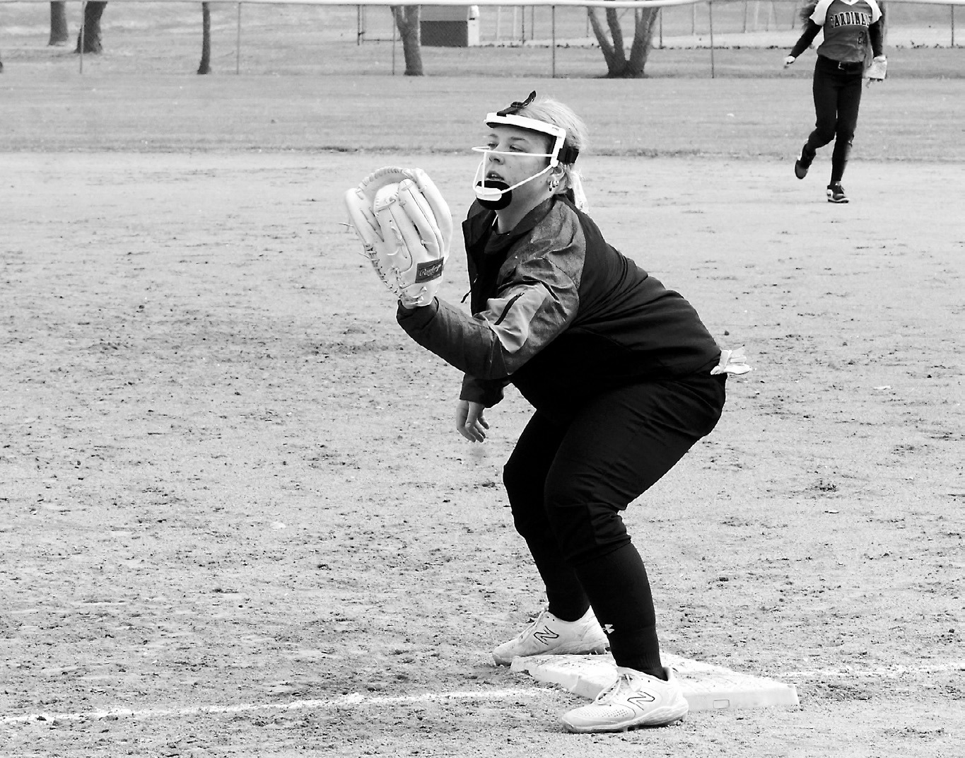 Claire Mehlhoff makes a catch at first base for the third out against Northern Lights on April 30 in Munich. Photo by Larry Stokke