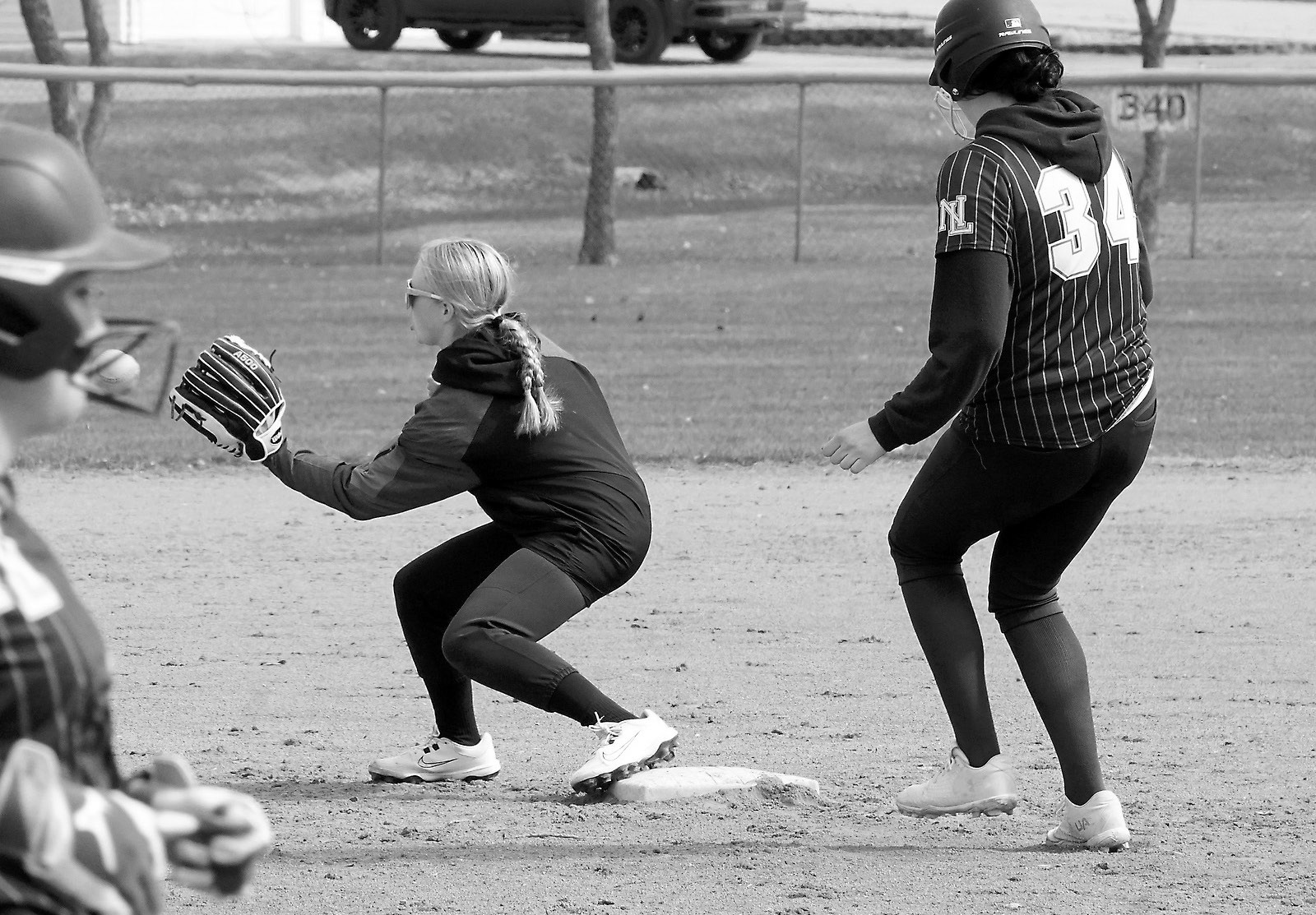 Harper Jacobson records an out at third base against Northern Lights. Photo by Larry Stokke