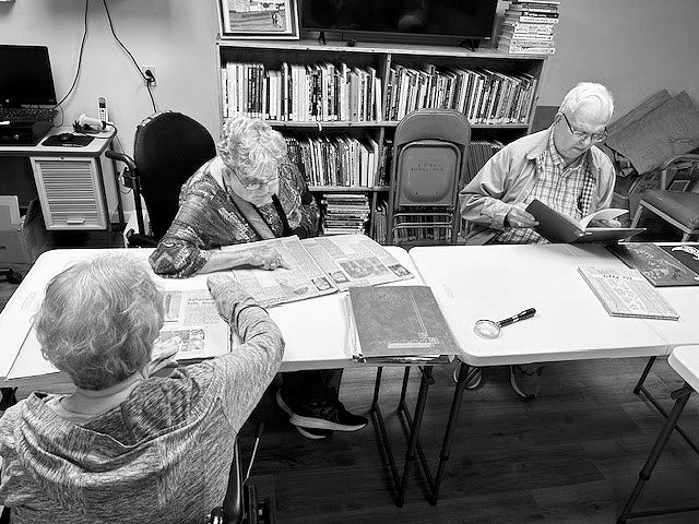 Bonnie, Darlene, and Dale at the library.