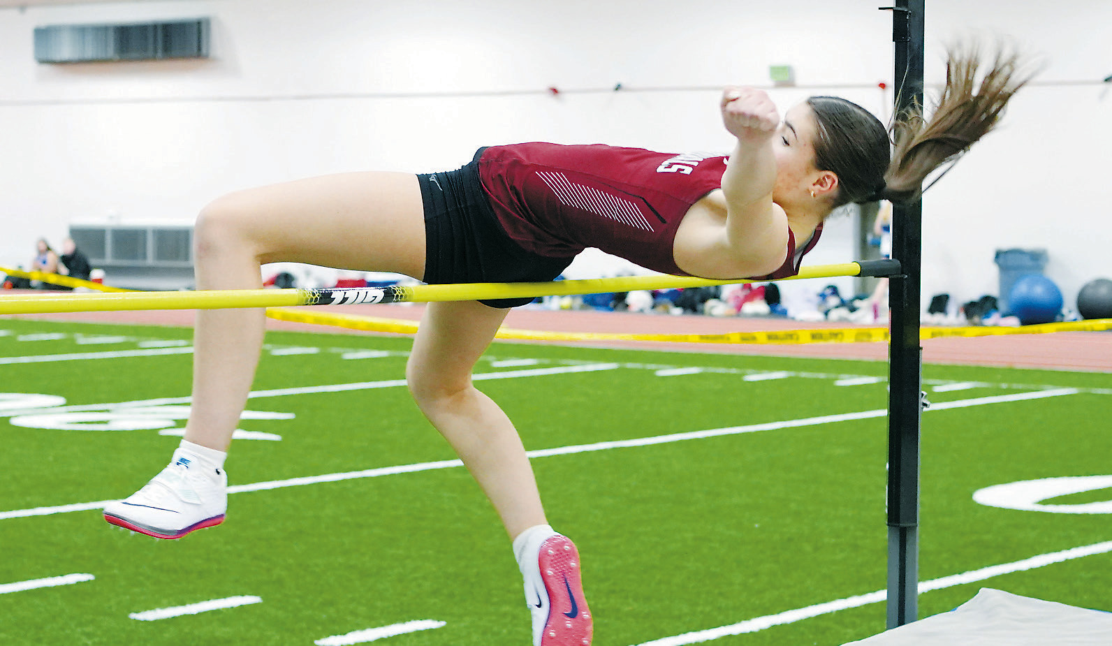 Performer of the Meet for the Lady Cards, Taya Feist placed second in the high jump with a height of 4' 6'. Photo by Larry Stokke