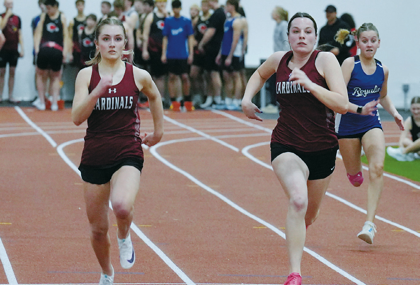 Ella Goodman and Erika Bakke competed in the 200-meter dash, earning sixth and fourth place, respectively. Photo by Larry Stokke