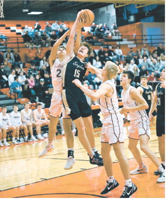 Garret Willits jumps and battles for the ball in the win over the Cardinals Monday night. Photo by Ashley Schafer