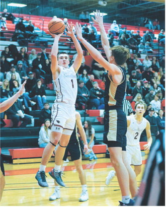 Eastyn Schaefer drops in a basket of the opening round of the Region 2B Tournament and finished the game with a team-high 14 points. Photo by Larry Stokke