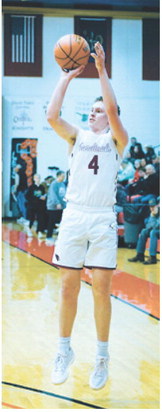 Levi Swanson adds three points to his 10-point night in the loss to the North Border Eagles. Photo by Larry Stokke