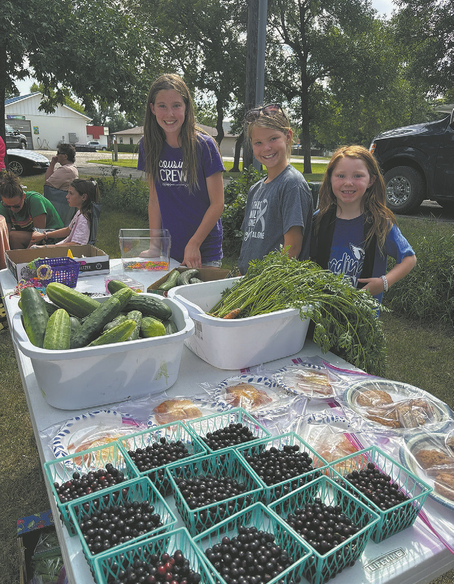 Members of the Chaput family showcase their impressive produce at the farmers market. Borderland Press photo