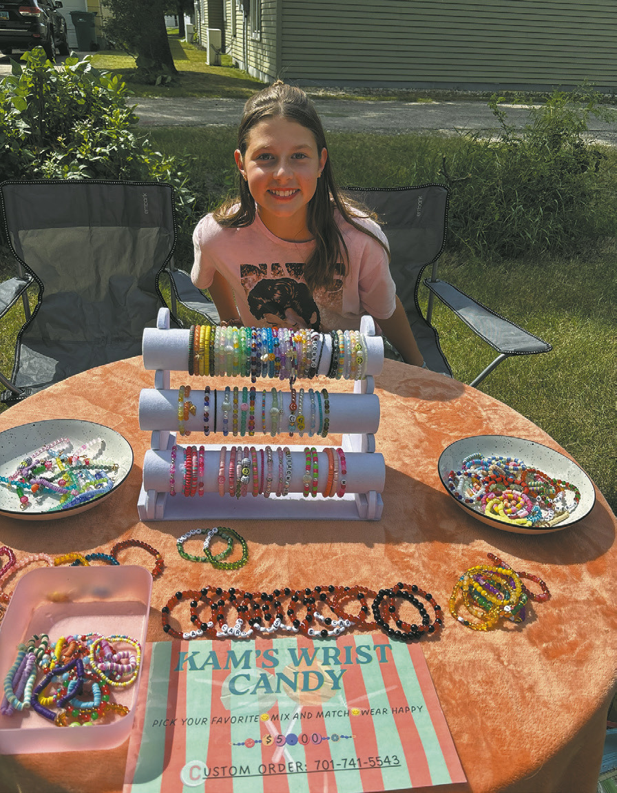 Kamdyn Krom of Kam’s Wrist Candy displays her handmade bracelets at the farmers market. Borderland Press photo