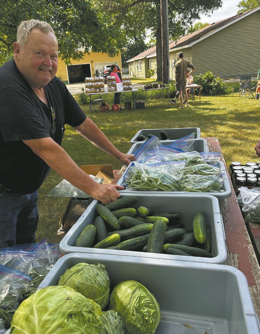 Jerry Howatt pauses for a photo with his produce and canned goods at the farmers market. Borderland Press photo