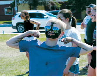 Game face on. A sixth-grade student shows off face paint and team spirit before taking on teachers and staff in the annual end-of-the-year kickball game at Langdon Area Elementary. Photo by Larry Stokke