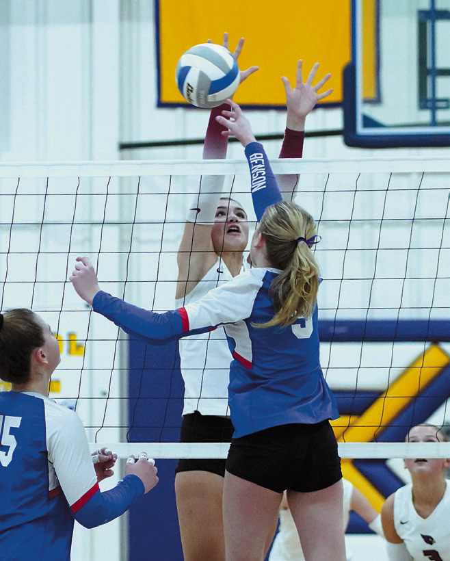 Taya Feist was strong at the net with five kills and four blocks in the win over a tough Benson County team. Photo by Larry Stokke.