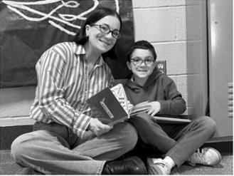Jessi Sunderland reads with her son, Hayes. Photo by Sarah Overby
