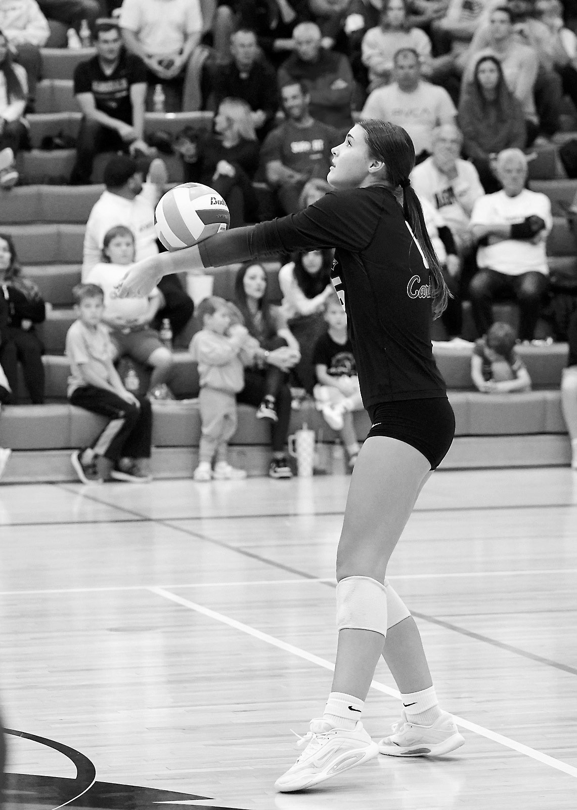 Taya Fiest passes the ball to a teammate in the game against the Eagles. Photo by Larry Stokke.