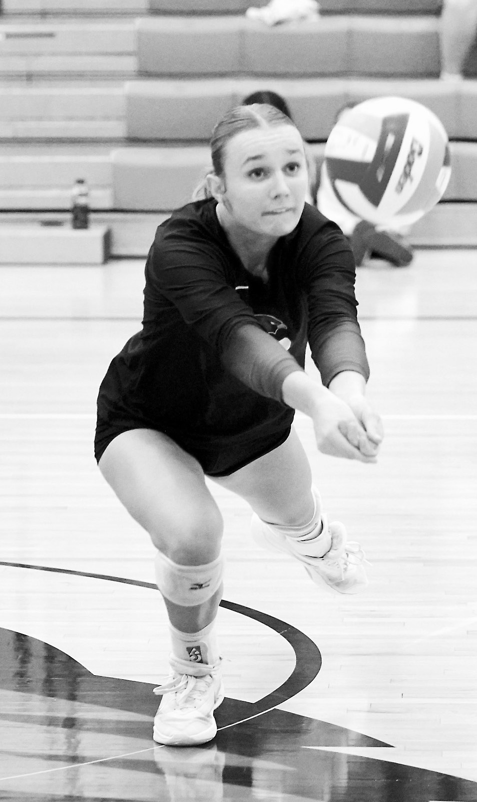 Kemi Morstad with a dig in the Cards' win over the Eagles. Photo by Larry Stokke.