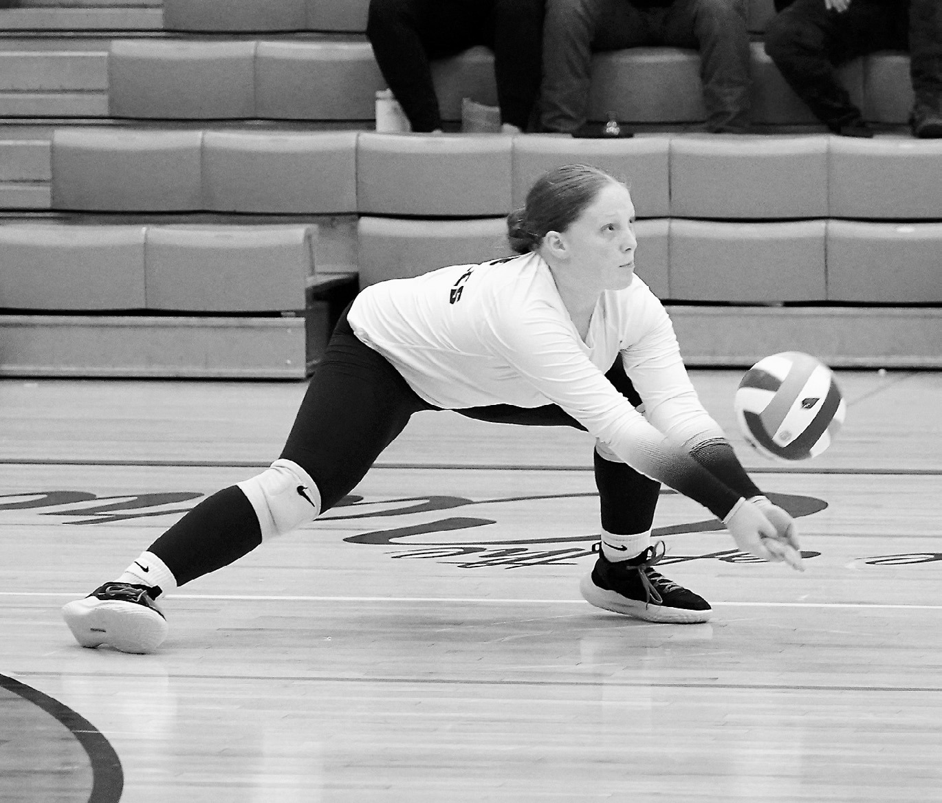 Amelia Carpenter gets low and digs the ball in the Eagles' game against the Cardinals on Sept. 18. Photo Larry Stokke.