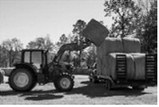 Loads such as seed, fertilizer, equipment and hay bales are subject to vibration, swaying, centrifugal force, inertia, wind and other forces during transit. USDA photo