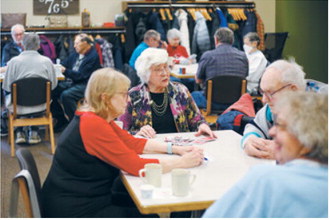People gather at the Broadway Station Senior Center in Fargo on Wednesday, Dec. 10, 2025, for Pinochle Day. Chris Flynn / The Forum