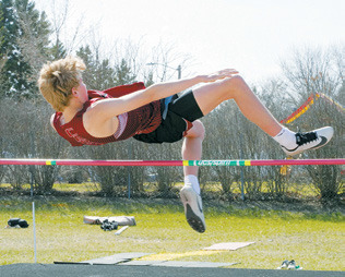 Caleb McDonald places 3rd with a personal best in highjump of 5'4'. Photo by Larry Stokke.