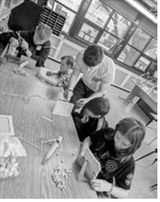 Pom pom art: Jr leaders working with Cloverbud members. Submitted photo