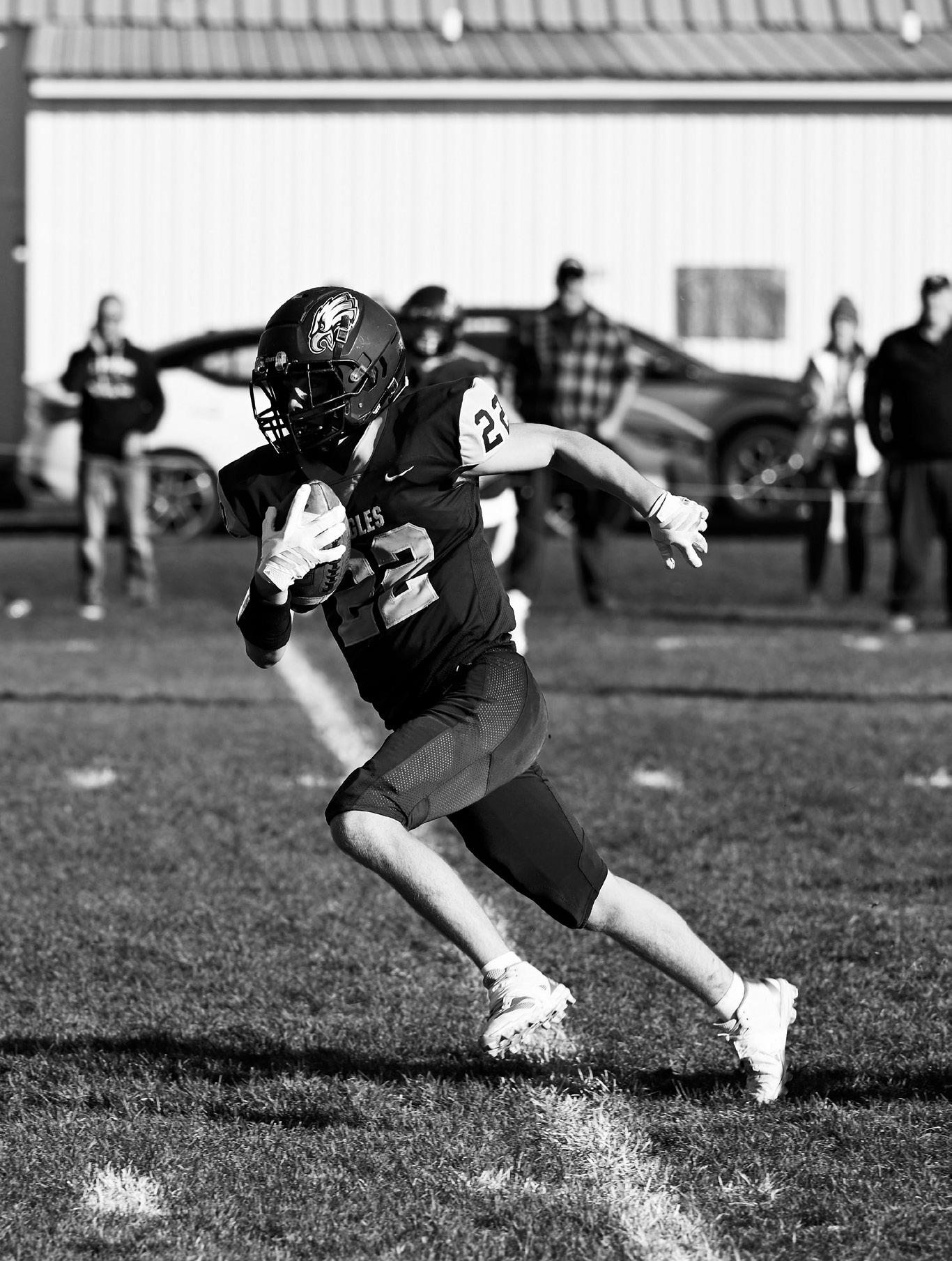 Zeke Symington gaining yards for the Eagles. Photo by Ashley Schafer.
