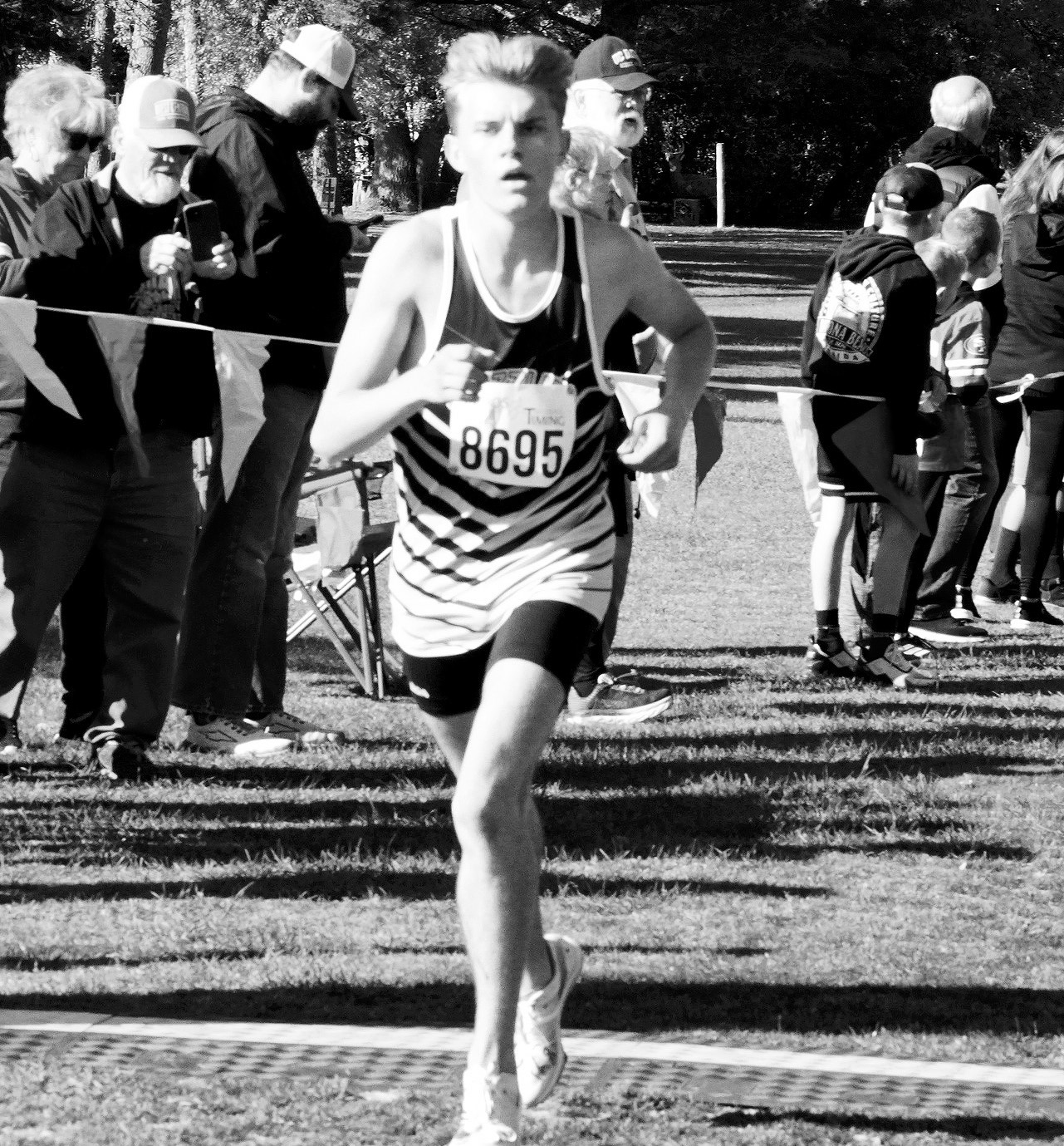 Nash Fitzsimonds finished 16th out of 206 runners to qualify for the state cross country meet. Photo by Larry Stokke.