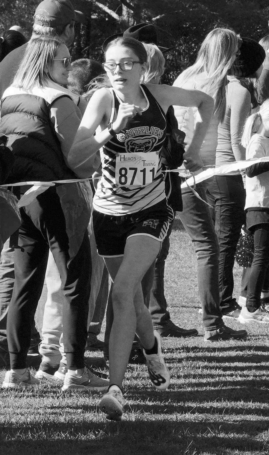 Maddy Robinson crossed the finish line in 29th place, qualifying her for the state cross country meet. Photo by Larry Stokke.