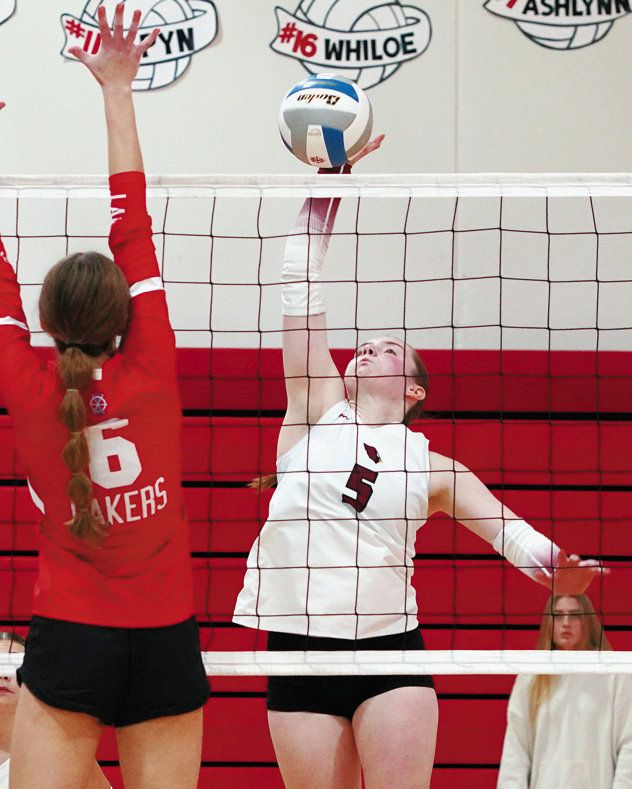 Meredith Romfo slams down a kill at the Des Lacs Volleyball Tournament. Photo by Larry Stokke.