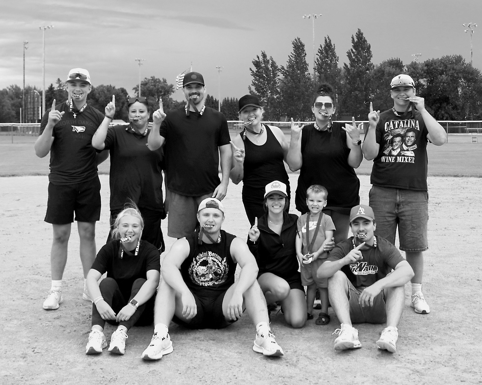 The Softball Fundraiser Champion team - Back row (L-R) Landon Schneider, Morgan Kempert, Jesse Zeis, Skyler Moline, Shannon Bjornstad; front row: McKenna Schneider, Jack Romfo, Myca Flink, Parker Flink, and Mason Romfo. Photo by Larry Stokke.