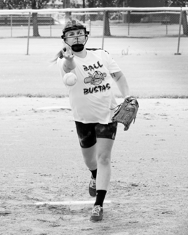 Brynn Williams eyes the batter and sends a pitch across the plate. Photo by Larry Stokke.