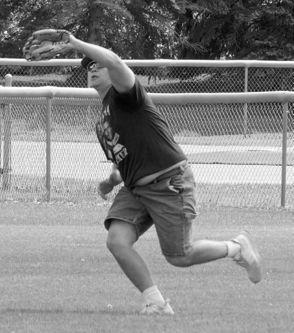 Cole Welsh catches a ball hit deep into center field. photo by Larry Stokke.