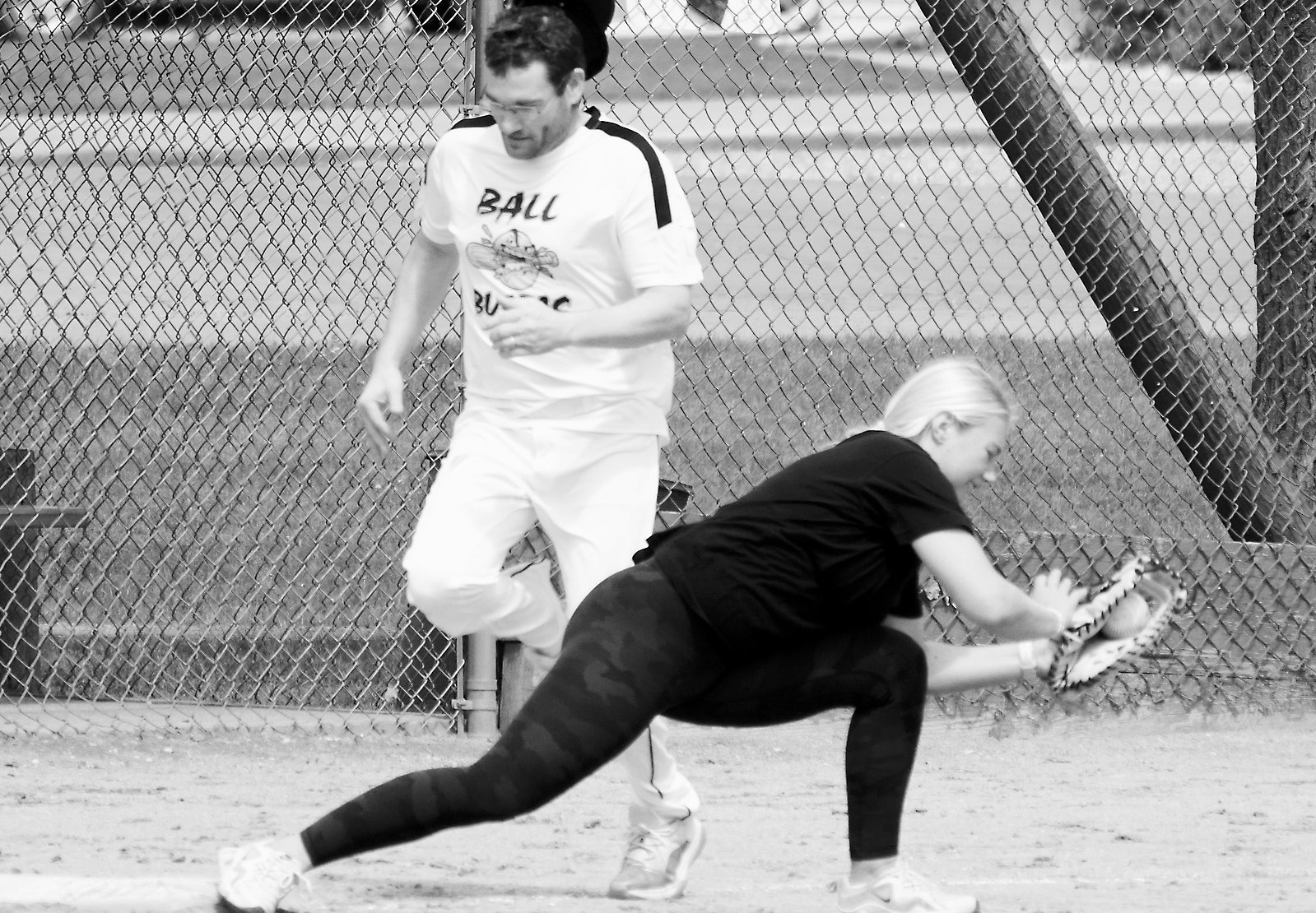 McKenna Schneider stretches out at first base and puts Josh Schaefer out. Photo by Larry Stokke.