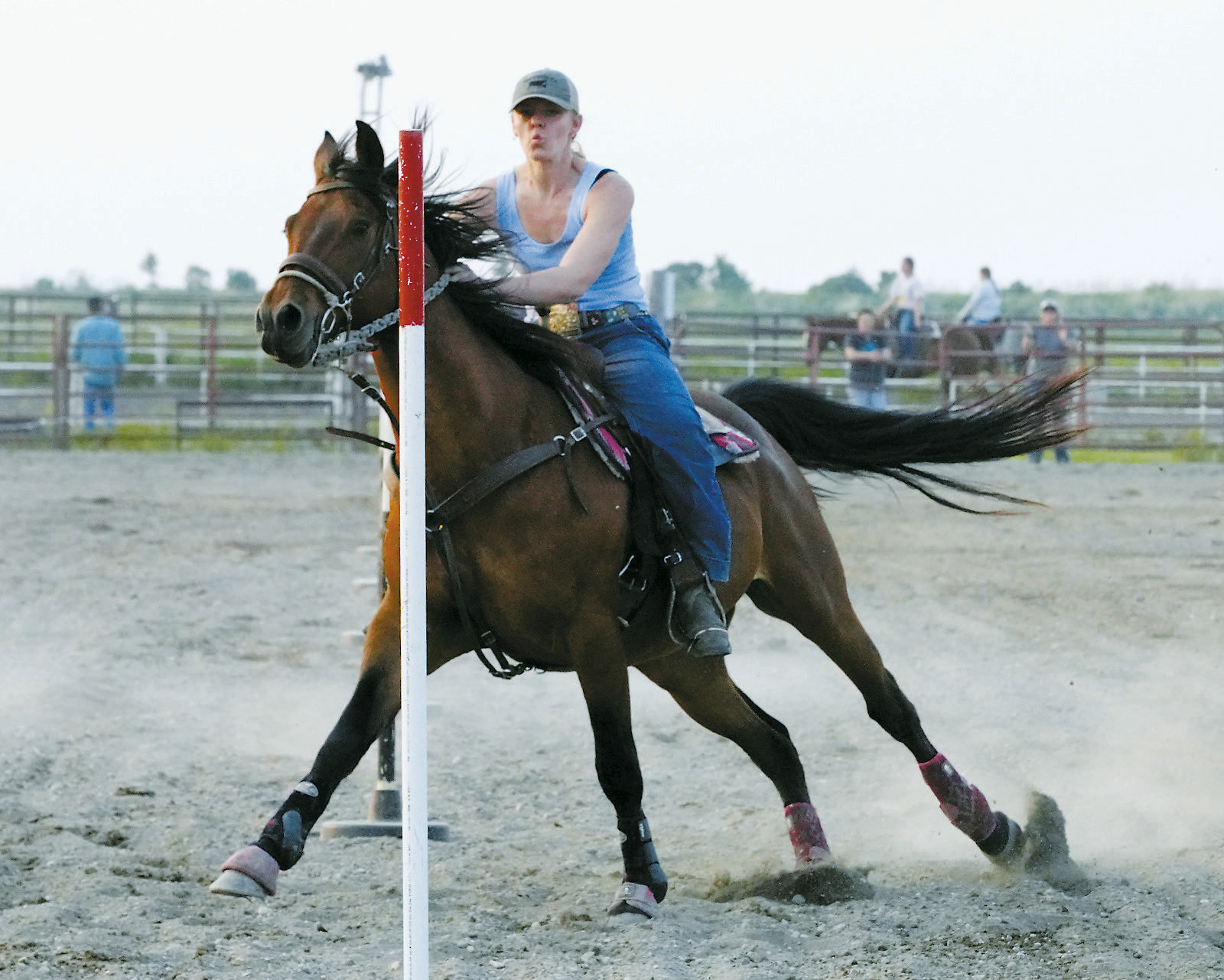 Carmyn LeTexier on her horse Rocket had a great run in the poles class June 10 in Devils Lake. Photo by Larry Stokke.