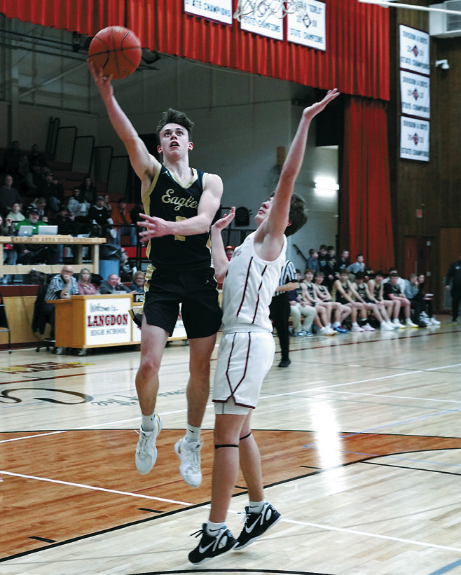 Kaden Moore went eight for nine from the line and had a great game, finishing with a 17-point night. Photo by Larry Stokke.
