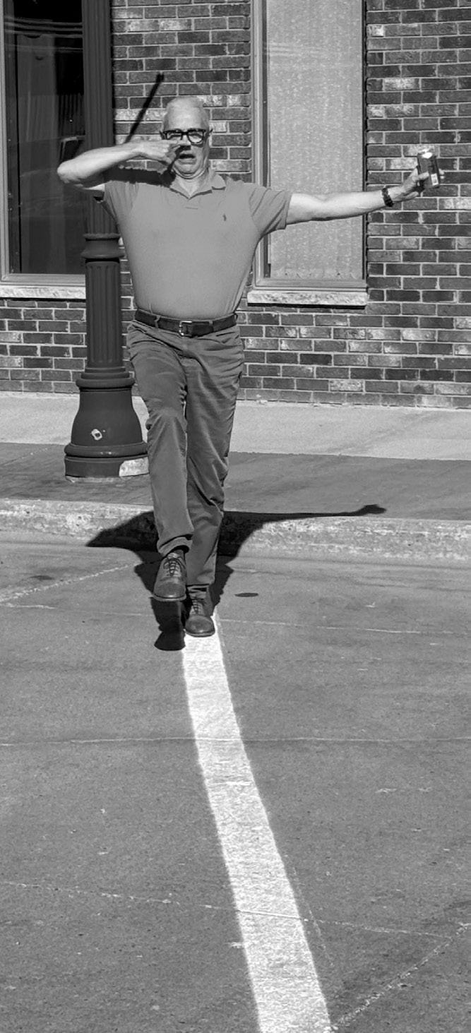The author enjoying a fine sunny afternoon practicing his field sobriety test moves on the recently perfectly painted lines.