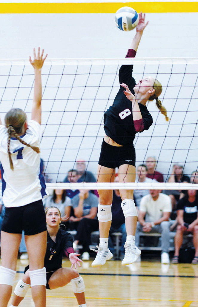 Hilary Haaven rises for a kill during the Cardinals’ volleyball action in Northern Cass. Photo by Larry Stokke
