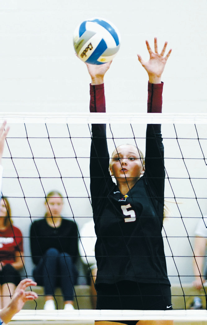 Hallie Overby goes up for a block during the Northern Cass Tournament on Aug. 29. Photo by Larry Stokke