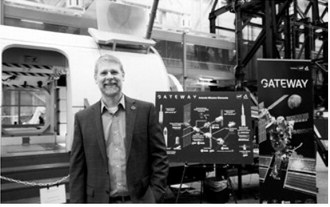 At the time of the Artemis II mission, North Dakota native Chris Johnson served as deputy manager of NASA's Gateway HALO (Habitation and Logistics Outpost) module. Johnson is shown standing in front of a mockup of the HALO module, a key component of the Gateway lunar space station. Photo courtesy of NASA