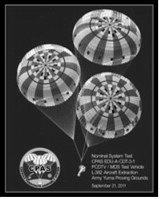 An Orion test vehicle descends beneath three main parachutes during a development test of NASA's Capsule Parachute Assembly System (CPAS). The parachute system is designed to safely return Orion astronauts to Earth following lunar missions. Photo courtesy of NASA