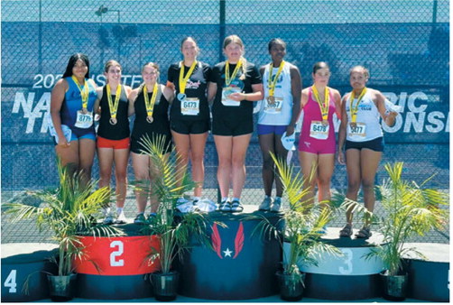 Fenja Lawson stands atop the first-place podium with fellow medalists in the girls 15-16 discus competition at the USATF National Junior Olympic Track &amp; Field Championships. Lawson edged the runner-up by 2 inches to claim the national title. Submitted photo