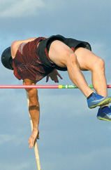 Nick Kingzett clears the bar at 11’ with room to spare. Photo by Larry Stokke.