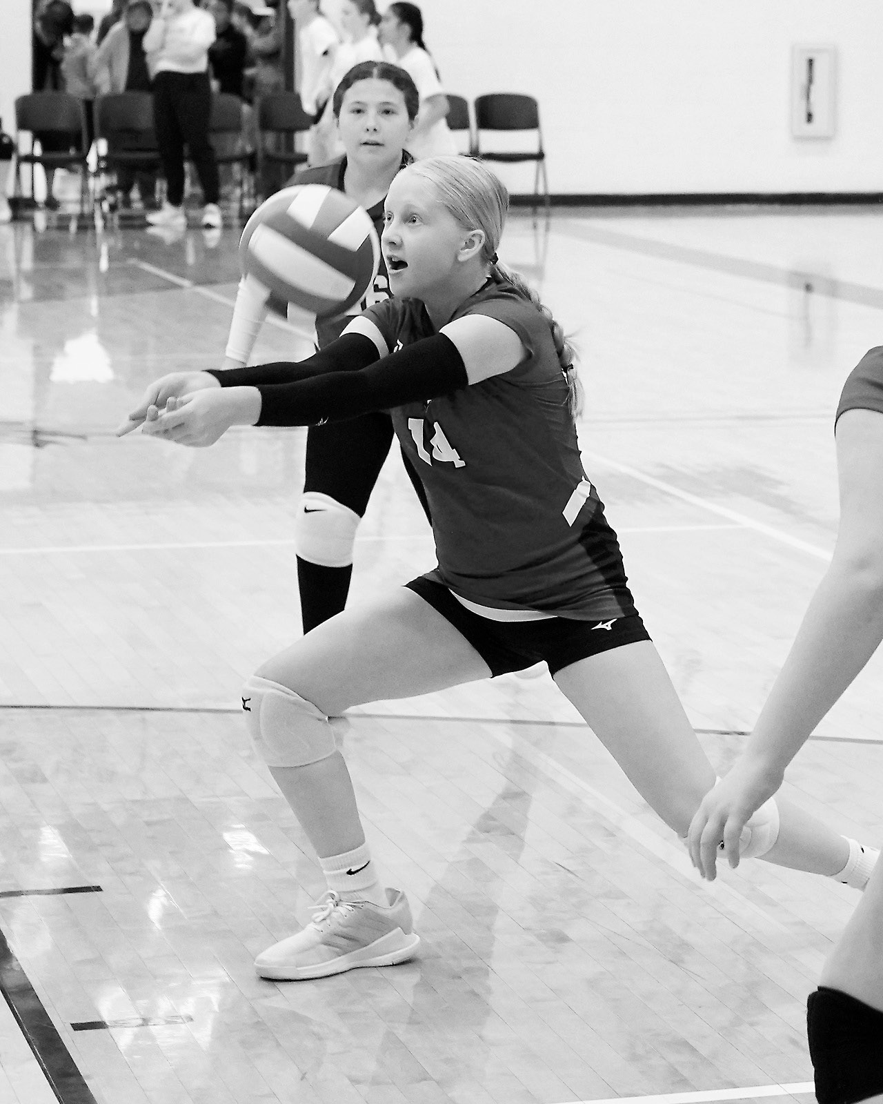 Charlotte Haaven digs the ball at the tournament in Park River on May 3. Photo by Larry Stokke.