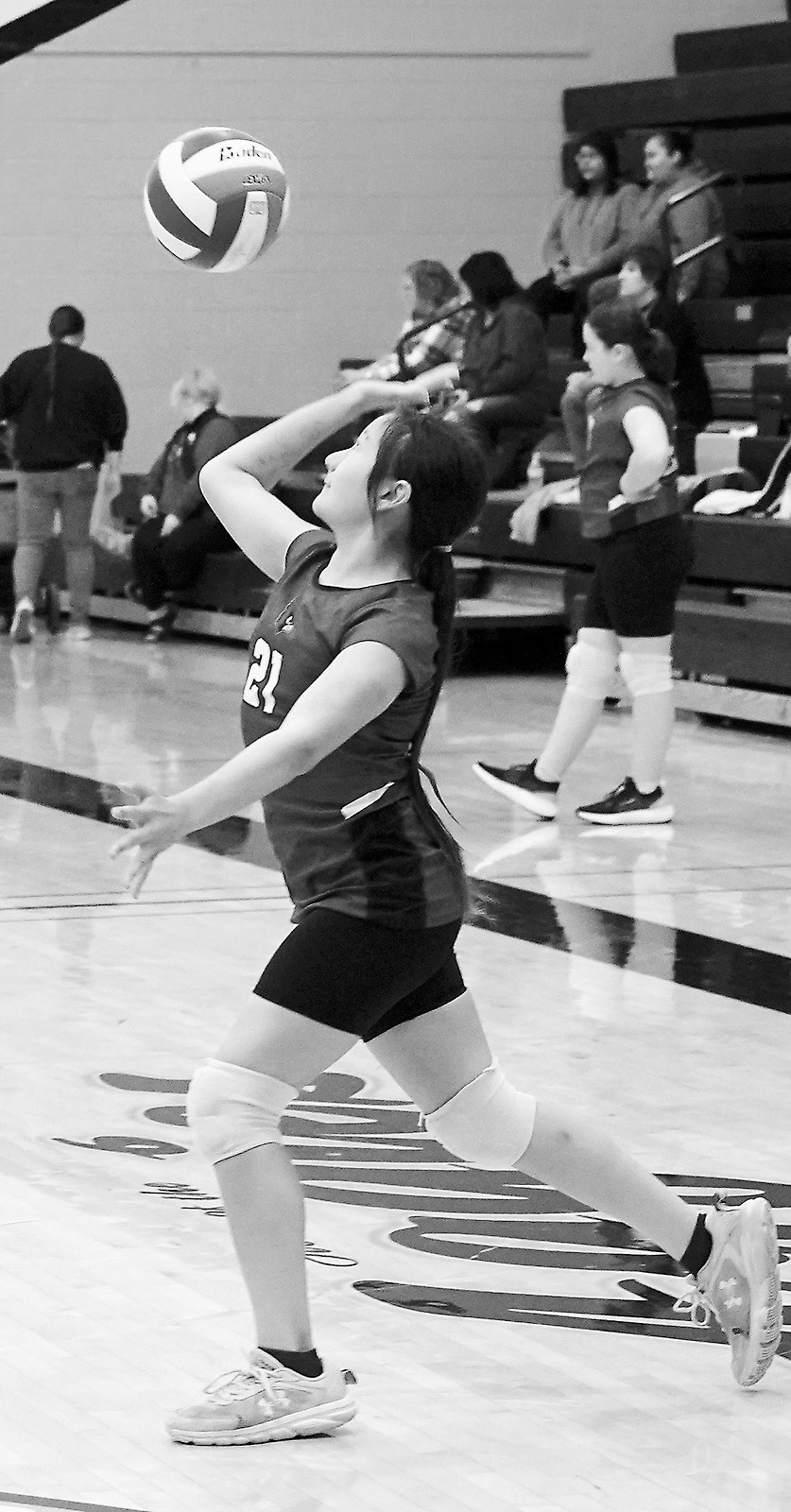 Chiles Karsky serves up an ace at the tournament in Park River on May 3. Photo by Larry Stokke.