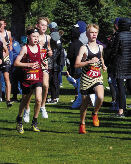 Dyson Askvig and Micah Crosby run side by side through the course in Rugby. Photo by Larry Stokke.