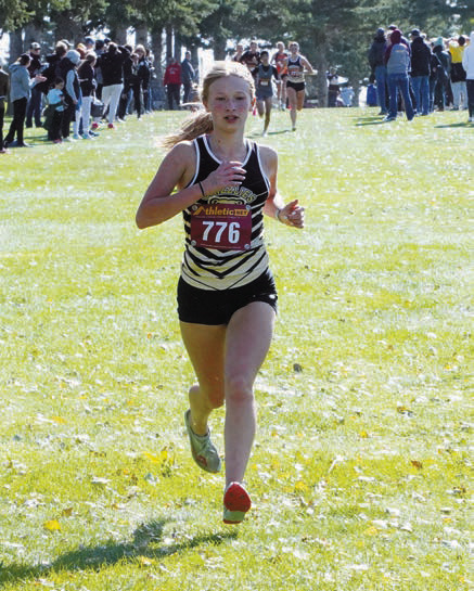 Emerson Helgoe ran to a 20th place finish at the Rugby XC Meet. Photo by Larry Stokke.