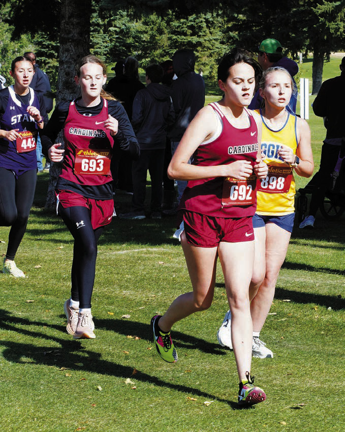 Heidi Crump followed by Chloe Foster make their way around the course in Rugby on Oct. 4. Photo by Larry Stokke.