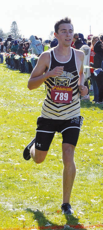 Mason Heller crossing the finish line at the Rugby meet. Photo by Larry Stokke.