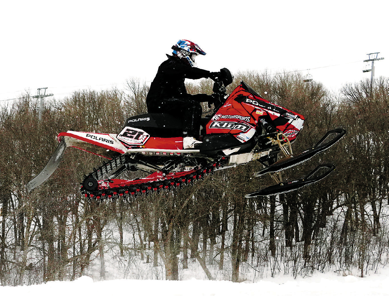 21R is Brady Pesek from Edmore. He competed in the snowmobile races at Frost Fire March 21st and 22nd. Photo by Larry Stokke